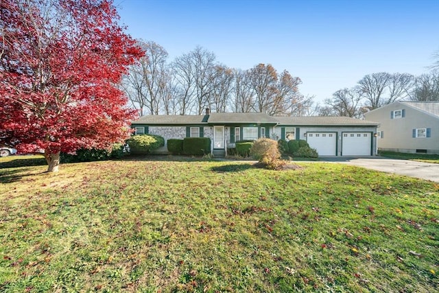 ranch-style home with an attached garage, driveway, and a front yard