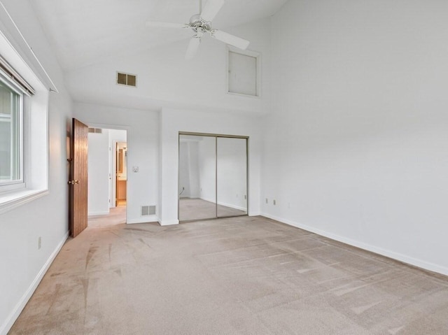 3 Loyalist Dr Unit 3, Uxbridge, MA 01569 - unfurnished bedroom with high vaulted ceiling, carpet flooring, a closet, baseboards, and ceiling fan