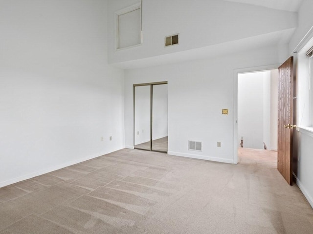 3 Loyalist Dr Unit 3, Uxbridge, MA 01569 - unfurnished bedroom with carpet, high vaulted ceiling, a closet, and baseboards