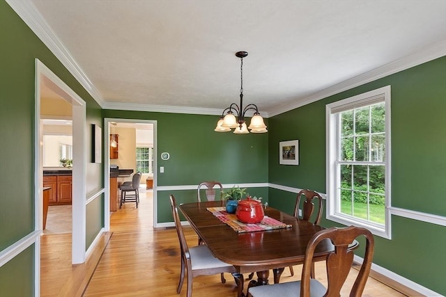 31 Fort Pond Hill Rd, Littleton, MA 01460 - dining space featuring plenty of natural light, crown molding, light wood-type flooring, and a chandelier