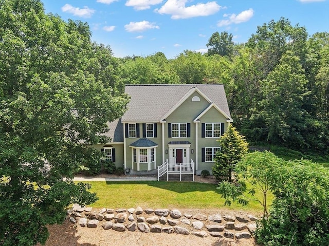 31 Fort Pond Hill Rd, Littleton, MA 01460 - colonial-style house featuring a front yard and a shingled roof