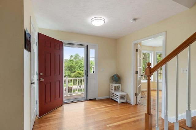 31 Fort Pond Hill Rd, Littleton, MA 01460 - foyer entrance featuring stairway, light wood-style flooring, and healthy amount of natural light