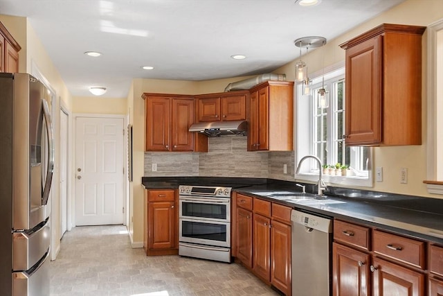 31 Fort Pond Hill Rd, Littleton, MA 01460 - kitchen featuring appliances with stainless steel finishes, under cabinet range hood, dark countertops, brown cabinetry, and recessed lighting