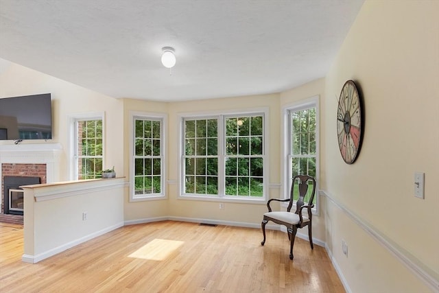 31 Fort Pond Hill Rd, Littleton, MA 01460 - unfurnished room featuring wood finished floors, healthy amount of natural light, and a fireplace