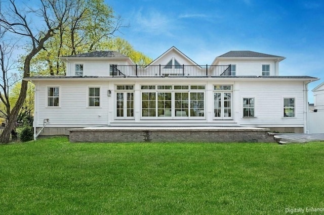 rear view of house featuring a patio area and a yard