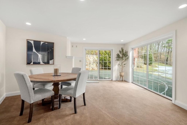 dining room with carpet flooring, recessed lighting, and baseboards