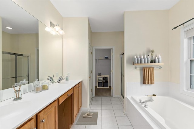 49 Champlain Cir, Plymouth, MA 02360 - full bathroom featuring a shower stall, double vanity, a bath, a spacious closet, and tile patterned flooring