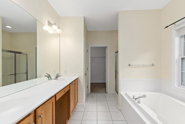 49 Champlain Cir, Plymouth, MA 02360 - full bath featuring a shower stall, double vanity, a bath, tile patterned floors, and a walk in closet