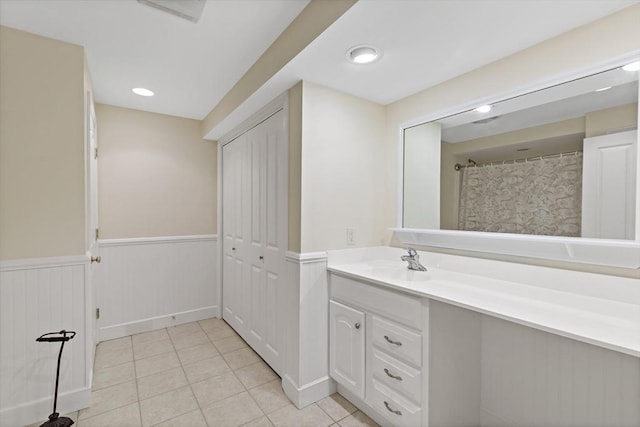 49 Champlain Cir, Plymouth, MA 02360 - full bath featuring vanity, tile patterned flooring, and wainscoting