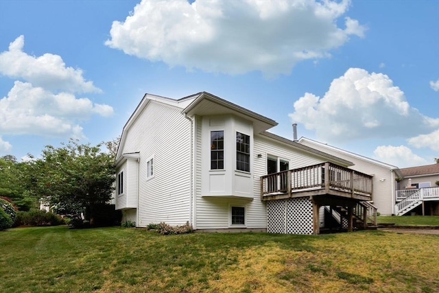 49 Champlain Cir, Plymouth, MA 02360 - rear view of property with stairway, a wooden deck, and a yard