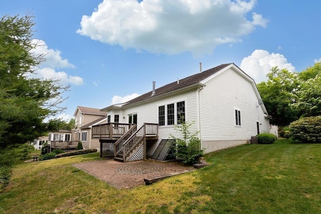 49 Champlain Cir, Plymouth, MA 02360 - back of property with a deck, a lawn, and a patio area