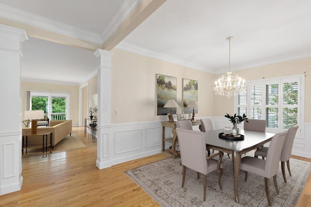 49 Champlain Cir, Plymouth, MA 02360 - dining area with light wood-style floors, crown molding, a chandelier, a decorative wall, and wainscoting