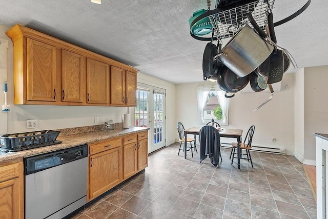 415 Holtshire Rd, Orange, MA 01364 - kitchen featuring stainless steel dishwasher, a textured ceiling, light countertops, french doors, and brown cabinetry
