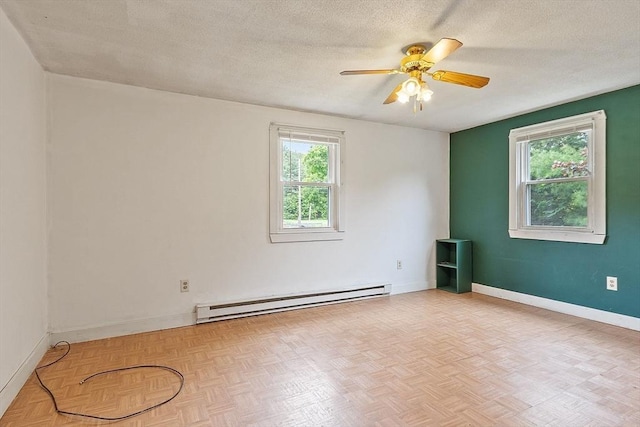 415 Holtshire Rd, Orange, MA 01364 - unfurnished room with baseboard heating, ceiling fan, baseboards, and a textured ceiling