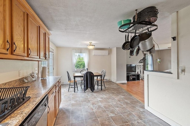 415 Holtshire Rd, Orange, MA 01364 - dining area with a wall unit AC, a textured ceiling, and baseboards