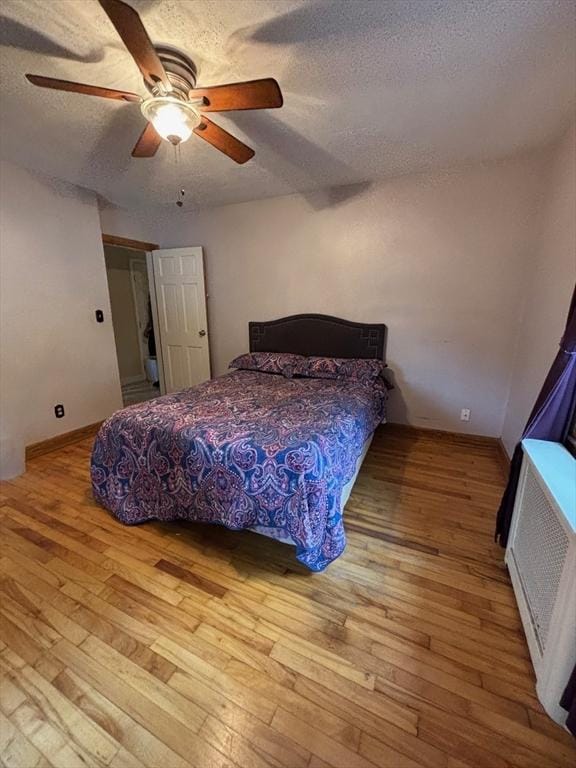 98 Varnum Rd, Dracut, MA 01826 - bedroom featuring a textured ceiling, wood-type flooring, and a ceiling fan