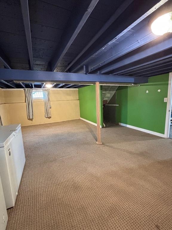 98 Varnum Rd, Dracut, MA 01826 - finished below grade area with carpet and refrigerator