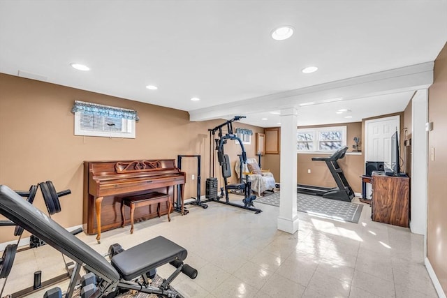 exercise room with ornate columns, baseboards, and recessed lighting