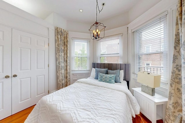 15 Garrison Rd, Brookline, MA 02445 - bedroom with a chandelier and light wood-type flooring