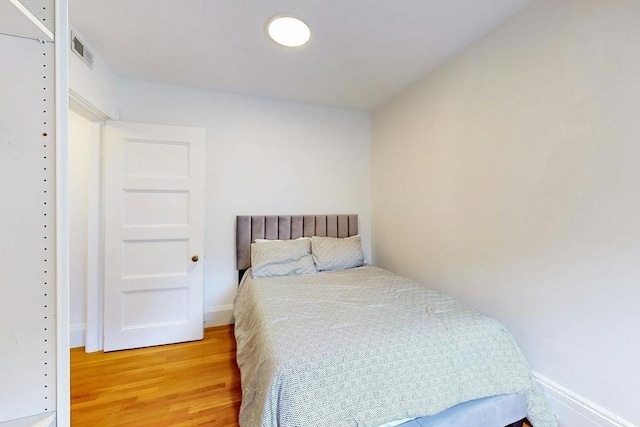 15 Garrison Rd, Brookline, MA 02445 - bedroom featuring light wood-type flooring and baseboards