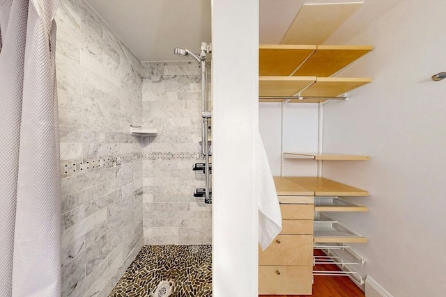 15 Garrison Rd, Brookline, MA 02445 - full bath featuring a tile shower and wood finished floors
