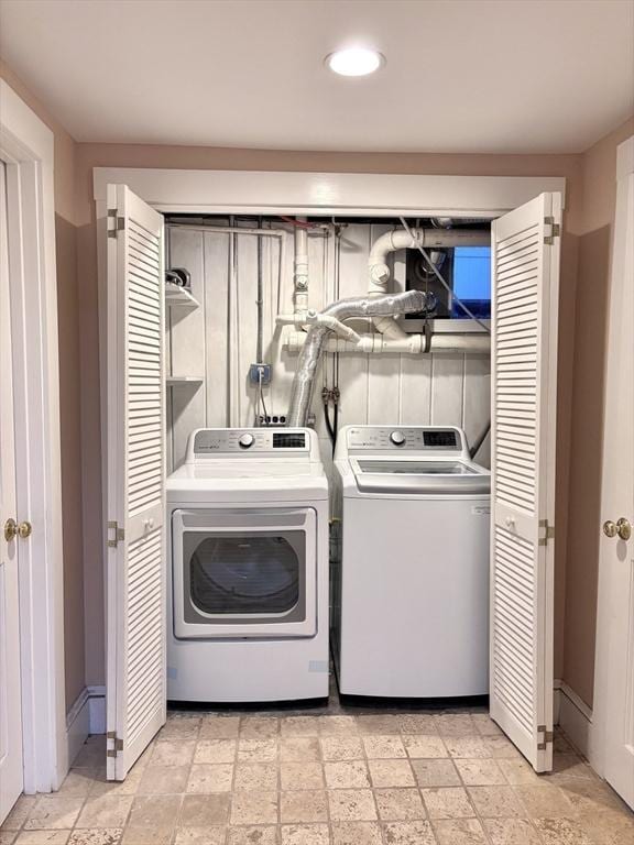 laundry room with recessed lighting, separate washer and dryer, and laundry area
