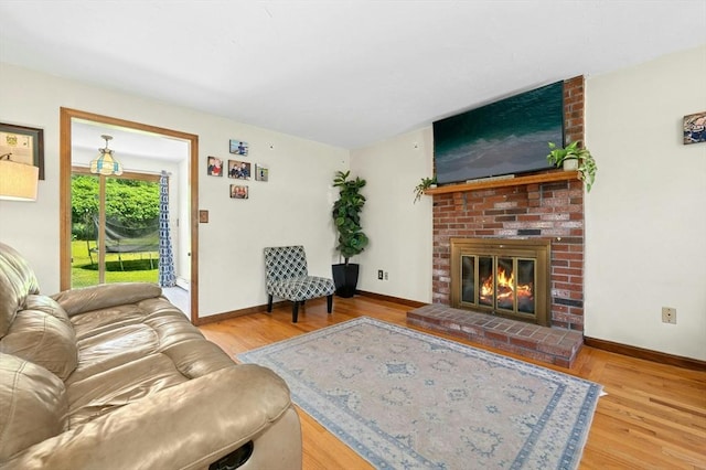3 Bellingham Rd, Blackstone, MA 01504 - living room with wood finished floors and a brick fireplace