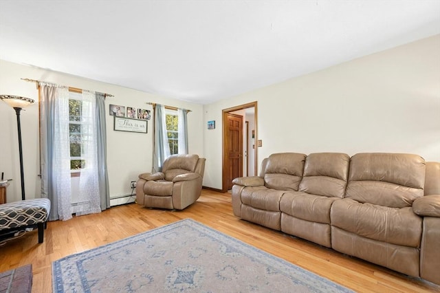 3 Bellingham Rd, Blackstone, MA 01504 - living room with a baseboard heating unit and wood finished floors