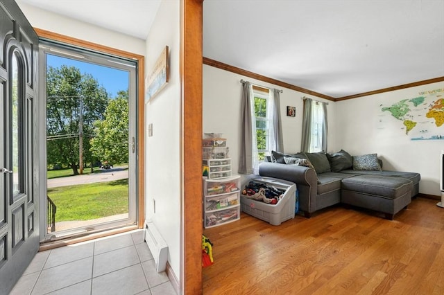 3 Bellingham Rd, Blackstone, MA 01504 - living room featuring crown molding, a baseboard radiator, and light tile patterned flooring