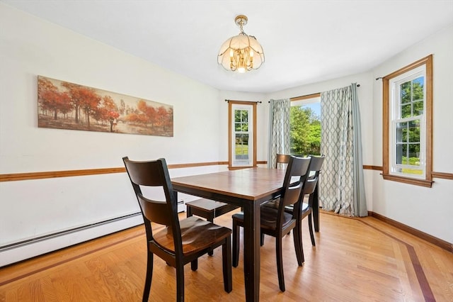 3 Bellingham Rd, Blackstone, MA 01504 - dining area featuring a chandelier, light wood finished floors, and a baseboard heating unit