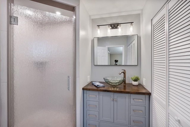 bathroom with vanity and walk in shower