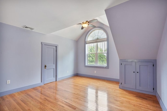 bonus room featuring lofted ceiling, ceiling fan, and light wood-type flooring