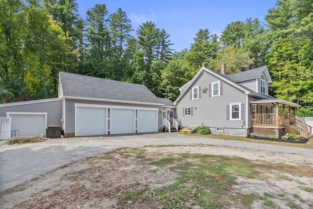 view of front of home featuring covered porch and a garage