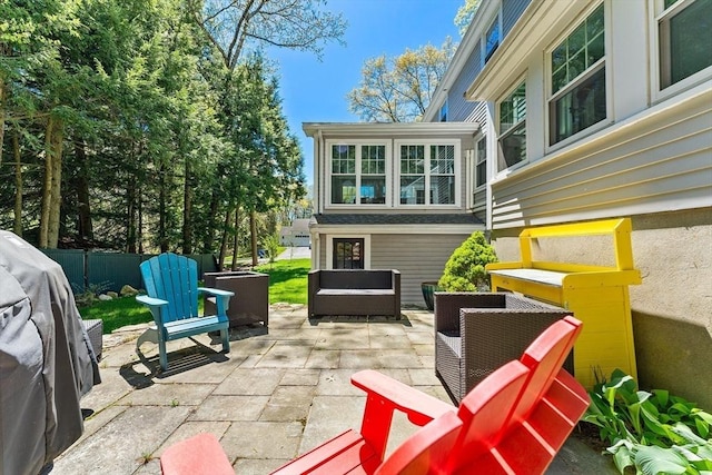 view of patio / terrace with an outdoor hangout area and fence