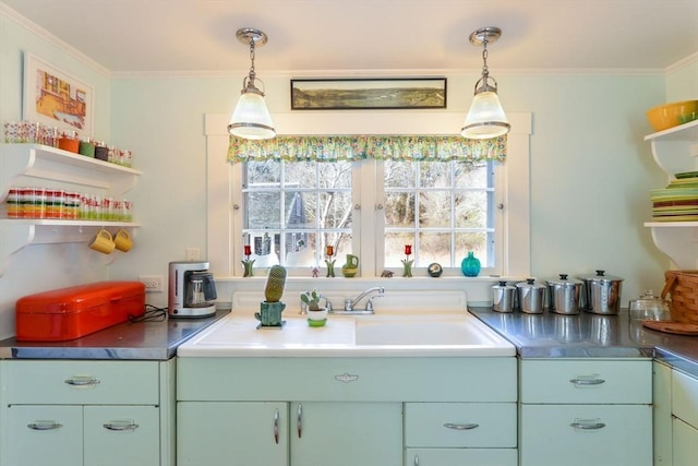 kitchen with open shelves, ornamental molding, dark countertops, and pendant lighting