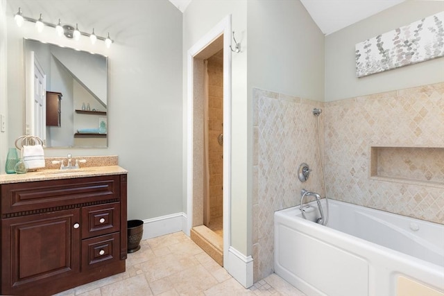 bathroom with shower with separate bathtub and vanity