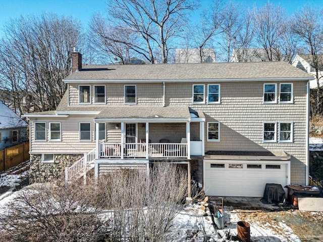 view of front of home with a garage and covered porch