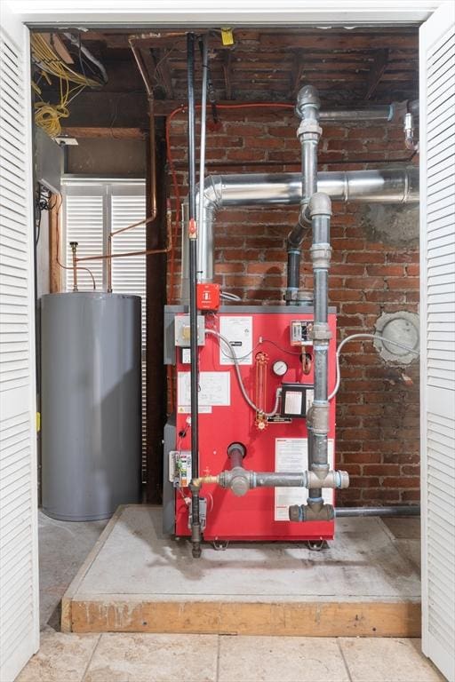 utility room with water heater