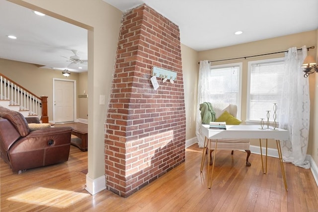 interior space featuring light hardwood / wood-style floors and ceiling fan