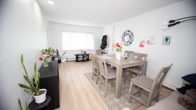 dining room with wood finished floors and recessed lighting