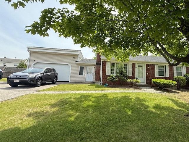 16 Firglade Dr, Attleboro, MA 02703 - ranch-style home with concrete driveway, a garage, a front yard, brick siding, and a chimney