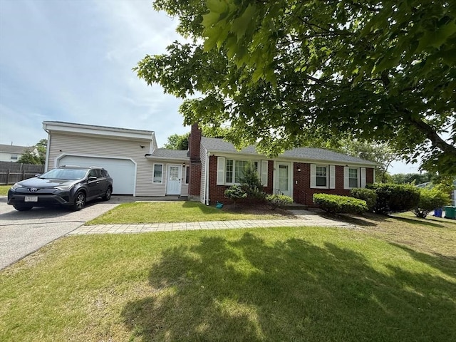 16 Firglade Dr, Attleboro, MA 02703 - single story home featuring an attached garage, driveway, a front lawn, and brick siding