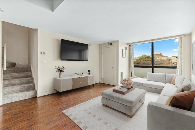 42 8th St Unit 1307, Boston, MA 02129 - living room featuring wood finished floors, stairs, and baseboards