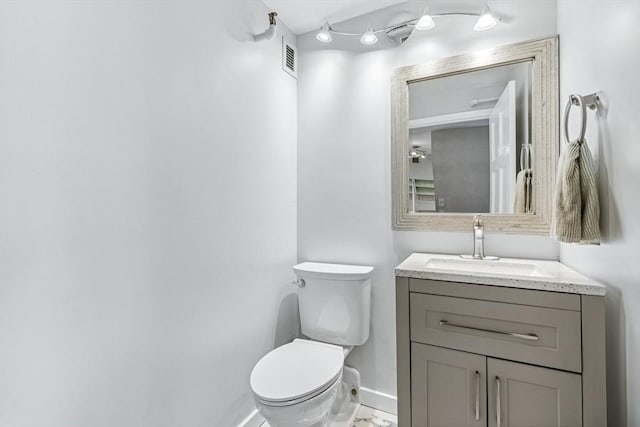 42 8th St Unit 1307, Boston, MA 02129 - half bathroom featuring toilet, vanity, and baseboards
