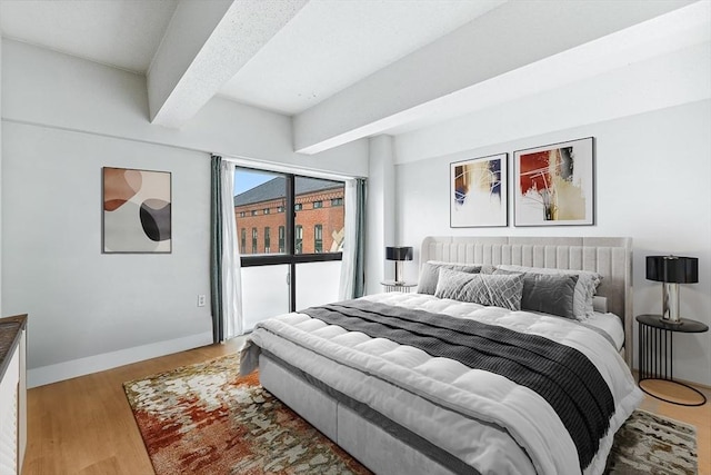 42 8th St Unit 1307, Boston, MA 02129 - bedroom with beam ceiling, baseboards, and wood finished floors