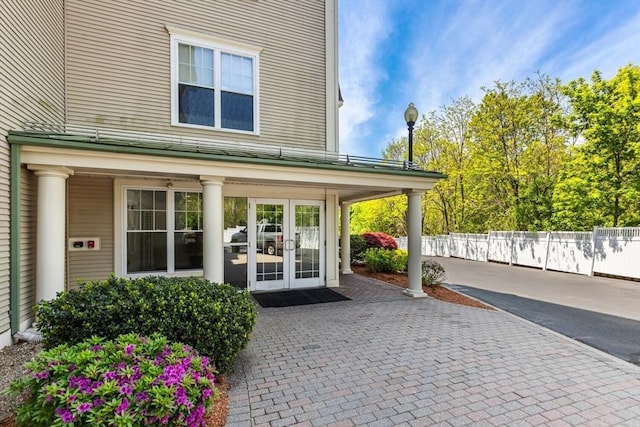 view of patio / terrace with french doors and fence