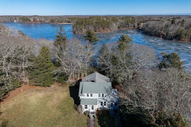 aerial view featuring a water view and a forest view