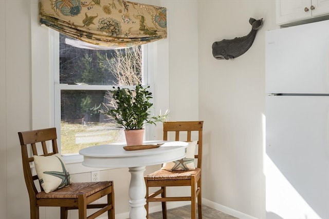 dining space with baseboards