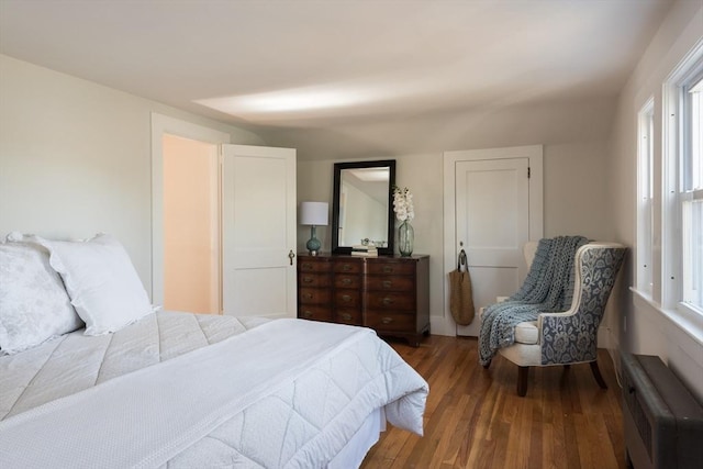 bedroom featuring wood finished floors