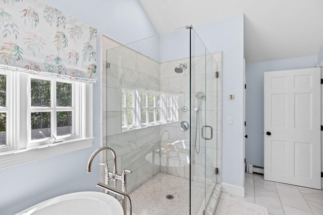 bathroom featuring a soaking tub, a shower stall, lofted ceiling, a baseboard radiator, and marble look tiles